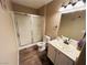 Well-lit bathroom featuring a shower and updated vanity at 5710 E Tropicana Ave # 2122, Las Vegas, NV 89122