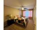 Comfortable bedroom with soft carpet, neutral walls, and natural light at 5710 E Tropicana Ave # 2122, Las Vegas, NV 89122