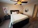 Bedroom with queen bed, ceiling fan, and large mirror at 5710 E Tropicana Ave # 2122, Las Vegas, NV 89122