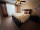 Spacious bedroom with queen bed, ceiling fan and large window at 5710 E Tropicana Ave # 2122, Las Vegas, NV 89122