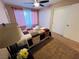 A warm bedroom features pink curtains and a spacious closet that enhances the room's functionality and comfort at 5710 E Tropicana Ave # 2122, Las Vegas, NV 89122