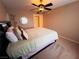 Comfortable bedroom with ceiling fan and view to hallway at 5710 E Tropicana Ave # 2122, Las Vegas, NV 89122