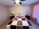 Cozy bedroom with a full-size bed and ceiling fan at 5710 E Tropicana Ave # 2122, Las Vegas, NV 89122