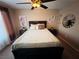 Bedroom with a queen-size bed, ceiling fan, and large window at 5710 E Tropicana Ave # 2122, Las Vegas, NV 89122