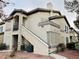 Two-story building with stairs and multiple windows at 5710 E Tropicana Ave # 2122, Las Vegas, NV 89122