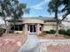 Inviting clubhouse entrance with a neutral color palette and easy access from landscaped walkway at 5710 E Tropicana Ave # 2122, Las Vegas, NV 89122