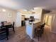 Open concept kitchen features a breakfast bar and stainless steel appliances at 5710 E Tropicana Ave # 2122, Las Vegas, NV 89122