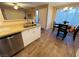 Kitchen boasts stainless steel dishwasher and light wood laminate floors at 5710 E Tropicana Ave # 2122, Las Vegas, NV 89122