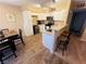 Modern kitchen with island and breakfast bar at 5710 E Tropicana Ave # 2122, Las Vegas, NV 89122