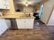 Modern kitchen with stainless steel dishwasher and white cabinets at 5710 E Tropicana Ave # 2122, Las Vegas, NV 89122