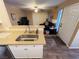 Kitchen with stainless steel sink and view into living room at 5710 E Tropicana Ave # 2122, Las Vegas, NV 89122