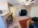 Open living area with a view into the kitchen and hallway at 5710 E Tropicana Ave # 2122, Las Vegas, NV 89122