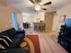 Spacious living room with a large TV and comfortable seating at 5710 E Tropicana Ave # 2122, Las Vegas, NV 89122