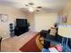 Living room features a sectional sofa and sliding glass door at 5710 E Tropicana Ave # 2122, Las Vegas, NV 89122