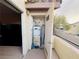 A small utility closet with an open door reveals a water heater and storage space on an outdoor balcony at 5710 E Tropicana Ave # 2122, Las Vegas, NV 89122