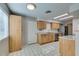 Bright kitchen with wood cabinets, granite counters, and stainless steel appliances at 607 Sierra Ln, Henderson, NV 89002