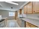 Efficient kitchen with wood cabinets, granite counters, and stainless steel appliances at 607 Sierra Ln, Henderson, NV 89002