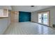 Bright living room with tile floors and access to a pool at 607 Sierra Ln, Henderson, NV 89002