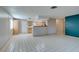 Living room with kitchen views and tile floor at 607 Sierra Ln, Henderson, NV 89002