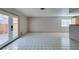 Living room with tiled floor and access to patio at 607 Sierra Ln, Henderson, NV 89002