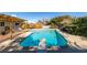 Sparkling blue pool with diving board and ample surrounding patio space at 607 Sierra Ln, Henderson, NV 89002