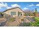 Landscaped backyard with gravel and desert plants at 6075 Jutland Ave, Las Vegas, NV 89122