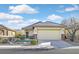 Single-story home with attached garage and landscaped front yard at 6075 Jutland Ave, Las Vegas, NV 89122