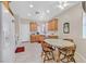 Eat-in kitchen with light wood cabinets and tile flooring at 6075 Jutland Ave, Las Vegas, NV 89122