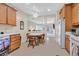 Kitchen with light wood cabinets, tile floor, and a round dining table at 6075 Jutland Ave, Las Vegas, NV 89122