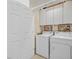 Laundry room with washer, dryer, and cabinets at 6075 Jutland Ave, Las Vegas, NV 89122