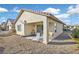 Covered patio with lounge chairs and gravel landscaping at 6075 Jutland Ave, Las Vegas, NV 89122