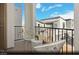 Private balcony with comfortable seating offering a view of the community at 6118 Garden Oasis St # Lot 4, Las Vegas, NV 89148