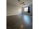 Bright bedroom with ceiling fan and wood-look floors at 6552 Boxwood Ln, Las Vegas, NV 89103