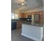 Modern kitchen featuring stainless steel appliances and a granite countertop island at 6552 Boxwood Ln, Las Vegas, NV 89103