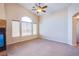 Well-lit room with a ceiling fan and large windows overlooking the neighborhood at 6752 Lookout Lodge Ln # 1, North Las Vegas, NV 89084