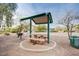 Inviting community picnic area with a shaded table, perfect for outdoor gatherings at 6752 Lookout Lodge Ln # 1, North Las Vegas, NV 89084