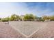 Community sand volleyball court, framed by mature trees and community landscaping at 6752 Lookout Lodge Ln # 1, North Las Vegas, NV 89084