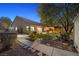 Landscaped backyard with stone pathway and lush greenery at 7220 Elderly Ave, Las Vegas, NV 89131