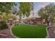 Landscaped backyard, covered patio, and gazebo at 7220 Elderly Ave, Las Vegas, NV 89131