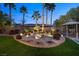 Landscaped backyard with water feature and multiple seating areas at 7220 Elderly Ave, Las Vegas, NV 89131