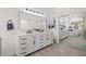 Bright bathroom boasts double vanity and mirrored closet at 7220 Elderly Ave, Las Vegas, NV 89131