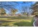 Large community park with grassy areas and trees at 7220 Elderly Ave, Las Vegas, NV 89131