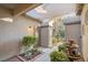 Inviting courtyard entry with fountain, shade structure, and lush landscaping at 7220 Elderly Ave, Las Vegas, NV 89131