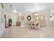 Elegant dining room with a chandelier, tile floors, and a built-in hutch at 7220 Elderly Ave, Las Vegas, NV 89131