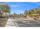 Gated community entrance with landscaping and trees at 7220 Elderly Ave, Las Vegas, NV 89131