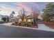 Single-story home with two-car garage and lush landscaping at 7220 Elderly Ave, Las Vegas, NV 89131