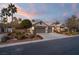 Single-story home with two-car garage and landscaped yard at 7220 Elderly Ave, Las Vegas, NV 89131