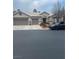 Single-story house with three-car garage and landscaped front yard at 7220 Elderly Ave, Las Vegas, NV 89131