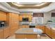 Kitchen features granite countertops and wooden cabinetry at 7220 Elderly Ave, Las Vegas, NV 89131