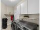 Laundry room with modern washer and dryer, and additional storage at 7220 Elderly Ave, Las Vegas, NV 89131